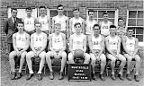 1945/46.  Front, l-r: Charles (Chuck) Rolph, 24-Richard (Dick) Voegeli, 23-Elmer Duerst, 6-John Richards, 32-Harvey Loeffel, 12-Melvin (Sunny) Lynn Jr., 5-?. Rear, l-r: Coach John Ponyicsanyi, 31-?, 30-Gene Lynn, 9-Rolland (Rollie) Zimmerman, Willard (Teddy) Zurbuchen, 11-Dean Zimmerman, Howard Voegeli. The ballboy and others  not positively  identified are: Ivan Schenk, Lawrence Arn and &#34;Junior&#34; Zentner.